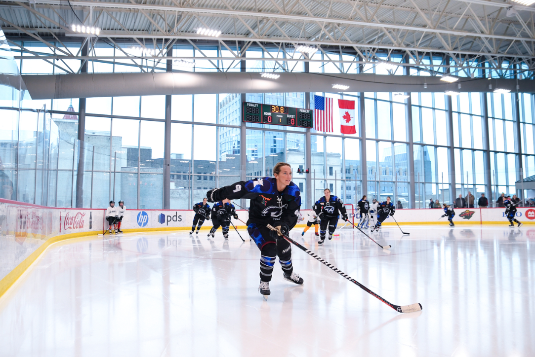 Minnesota Whitecaps players skate towards the camera at the TRIA rink in St. Paul, Minnesota on December 15, 2022.